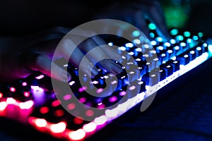 Hacker using laptop. Lots of digits on computer screen.