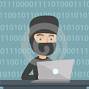 Hacker using laptop to steal information.