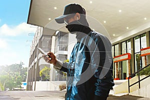 Unknown hacker using mobile phone