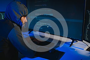 Hacker Using Multiple Computers For Stealing Data On Desk