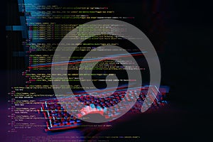 Hacker working with computer in dark room with digital interface around. Image with glitch effect.