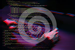 Hacker working with computer in dark room with digital interface around. Image with glitch effect.