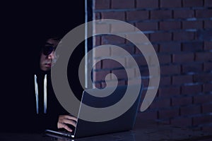Hacker working on his computer, Hacker stealing password and dat