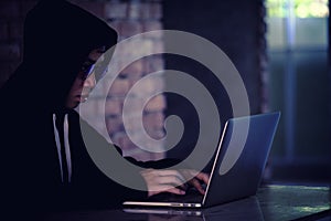 Hacker working on his computer, Hacker stealing password and dat