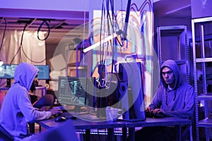 Hackers collaborating on coding virus