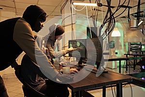Hackers team hacking computer network system, programming malware
