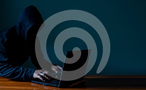 Hackers work on laptops in the dark. The concept of information security in the Internet network and information espionage