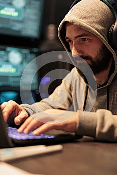 Hacking developer using computer to break system
