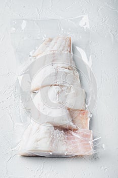 Haddock fish skinless in vacuum pack, on white background
