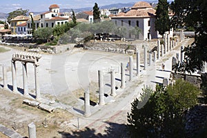 Hadrian library site ruins in Athens through modern houses