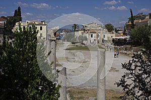 Hadrian library site ruins in Athens through modern houses