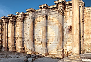 Hadrian`s Library at sunset, wall with columns, Athens, Greece. Remains of Ancient Greek building