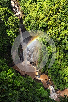 haew narok waterfall with rainbow from top view