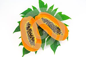 Haft cut papaya fruit and papaya leaf photo