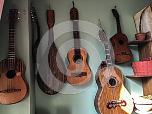 Hagan guitars in a green wall photo