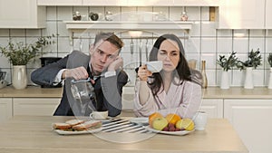 Haggard Couple Drinking Coffee in Morning at Home