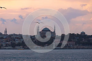 Hagia Sophia or Ayasofya Mosque at sunset from Kadikoy district of Istanbul photo
