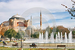 Hagia Sophia byzantine church in Istanbul and fountain in a park photo