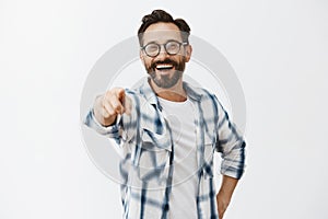 Haha got you. Portrait of carefree funny and emotive handsome mature coworker with beard in checked shirt and glasses