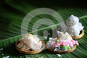 hai coconut muchkins, Sticky morsels, Rice flour mixed with toddy palm and shredded coconut Thai dessert on the green coconut leaf