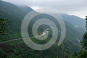 The Hai Van Pass, Da Nang, Vietnam. A beautiful road to drive by motorbike, very nice curves, turns and awesome view. Aerial view photo