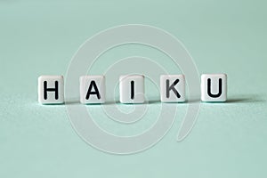 Haiku - word concept on cubes,text photo