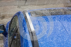 Hail on a car roof.