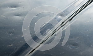 Hail Damage On Black Car Hood