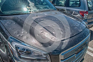 Hail damage to car photo