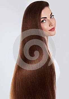 Hair.Beautiful woman with luxurious long hair. Gorgeous Model Girl with Healthy brown smooth shiny straight Hair.