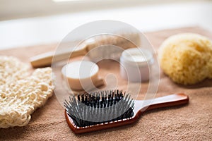 Hair brush, cream, sponge, soap bar and bath towel