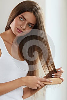 Hair Care. Beautiful Female Hair brushing Long Hair With Brush