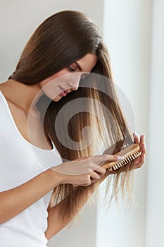 Hair Care. Beautiful Female Hair brushing Long Hair With Brush