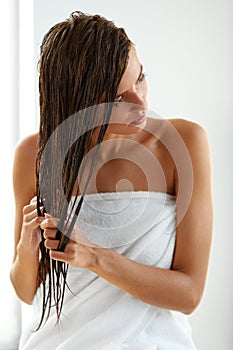 Hair Care. Beautiful Woman With Wet Hair In Towel After Bath