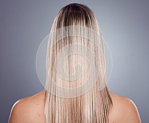 Hair care, blonde woman and back view of natural beauty, keratin texture and beauty salon cosmetics on studio background