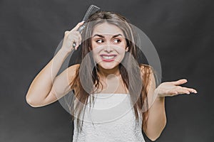 Hair Care. Closeup Of Beautiful Girl After Bath Hairbrushing Healthy Straight Brown Hair. Young Woman Brushing Her Long