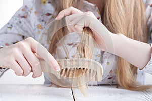 Hair Care. Closeup Of Beautiful Woman Hairbrushing Hair With Brush. Portrait Of Female Woman Brushing Long Straight Healthy