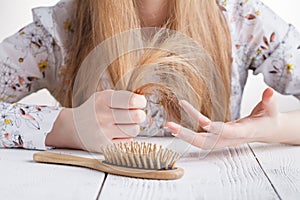 Hair Care. Closeup Of Beautiful Woman Hairbrushing Hair With Brush. Portrait Of Female Woman Brushing Long Straight Healthy