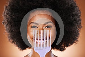 Hair care, comb and black woman with smile, natural beauty and skincare against brown studio background. Cosmetics