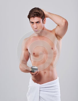 Hair care, cream and man on a white background for wellness, grooming and self care. Salon, health and isolated person