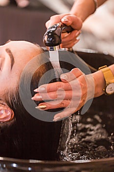 Hair care in modern spa salon. hair washing at a hairdressing salon