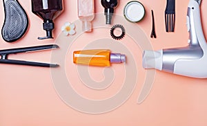 Hair care produts and styling items on orange background