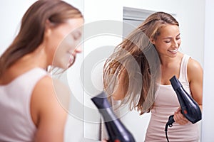 Hair care, smile and woman with blowdryer in bathroom for salon, cosmetic and conditioner treatment. Beauty, happy and