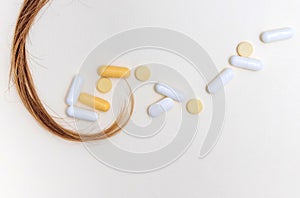 hair care and treatment concept.hair thread isolated with many pills