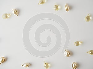 Hair care vitamin capsules on light background