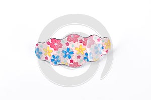 Hair clip with floral design.