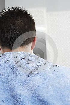 Hair Clippings On Man's Back photo