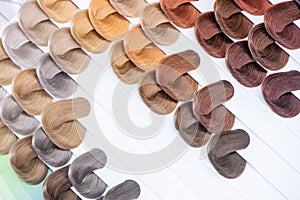 Hair color chart. Palette of dyed shiny hair samples. Catalog for selection in a beauty salon