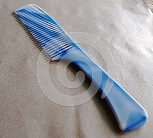 A hair comb that we use every day to straighten our hair. photo