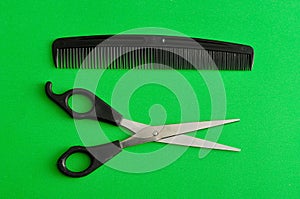 Hair cutting scissors and a comb